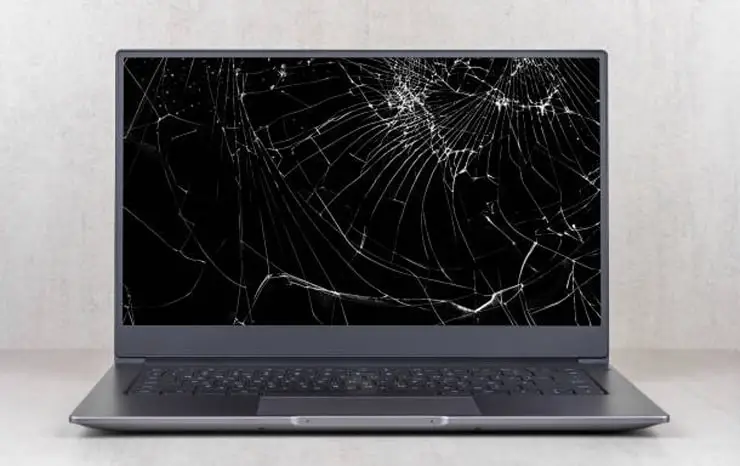 picture of a laptop with a broken screen