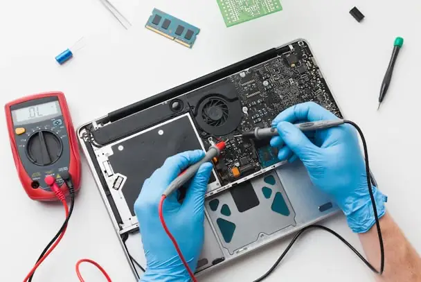 A Laptop motherboard being repaired In Welwyn